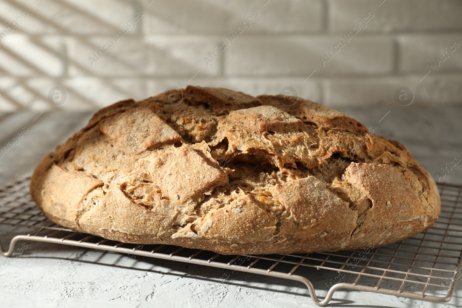 Photo of Freshly baked sourdough bread on grey table