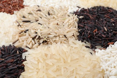 Different sorts of rice as background, closeup