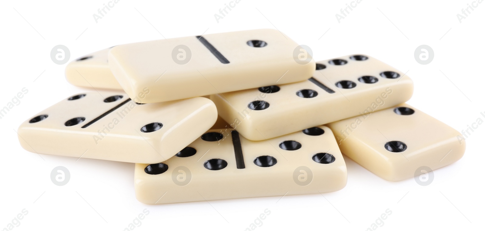 Photo of Pile of classic domino tiles on white background