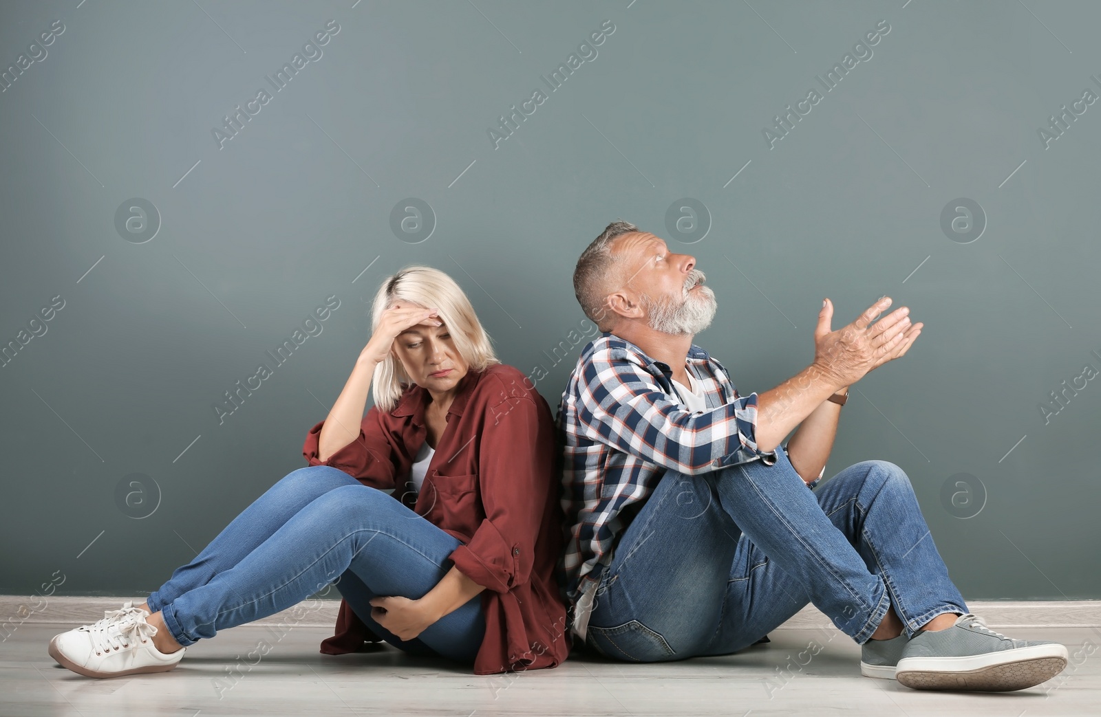 Photo of Mature couple having argument indoors. Relationship problems