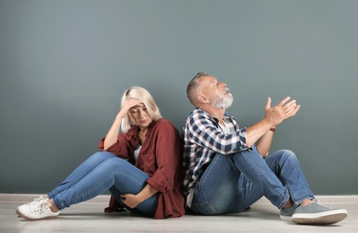 Mature couple having argument indoors. Relationship problems