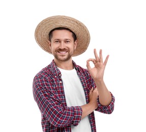 Photo of Happy farmer showing ok gesture on white background. Harvesting season