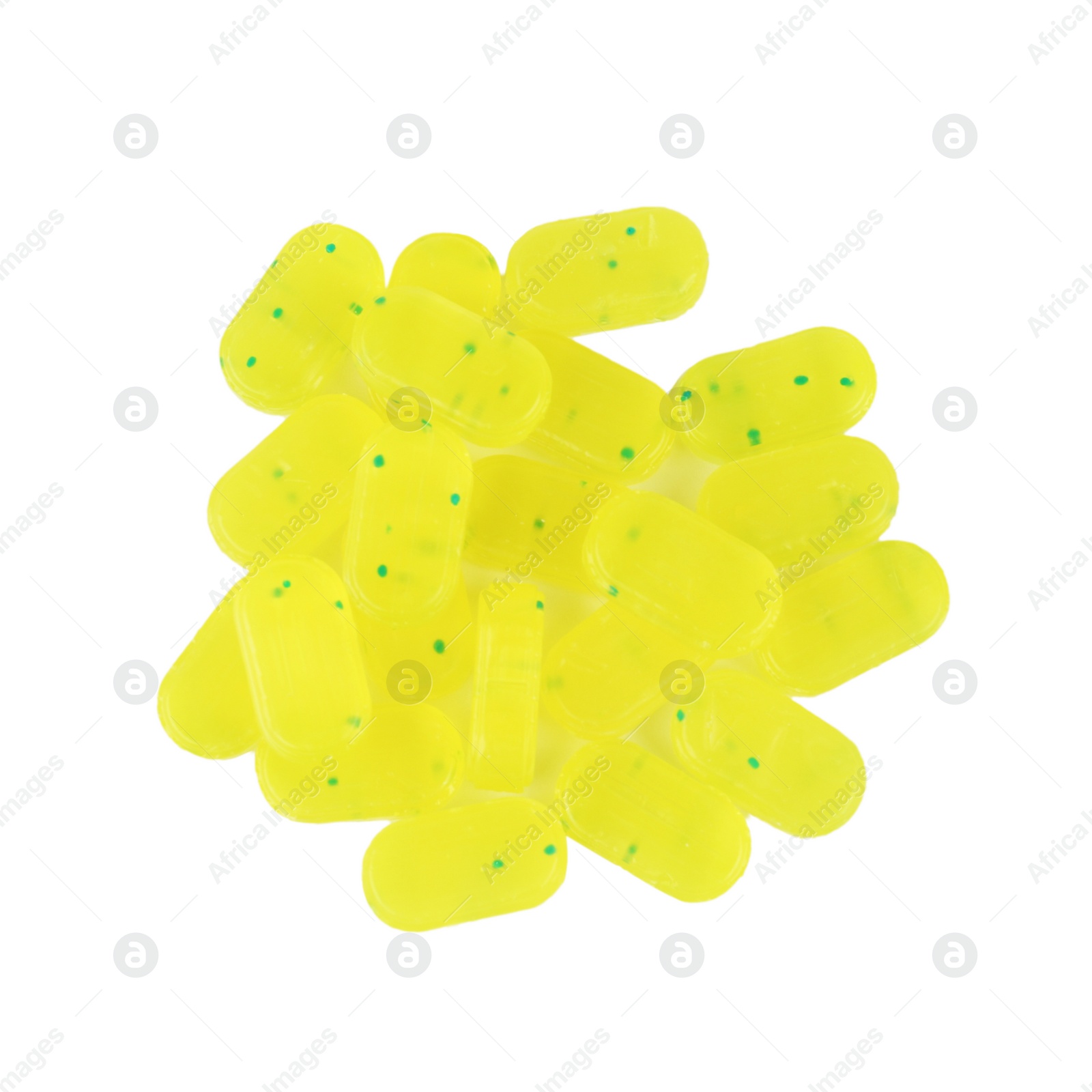 Photo of Pile of tasty lemon drops on white background, top view