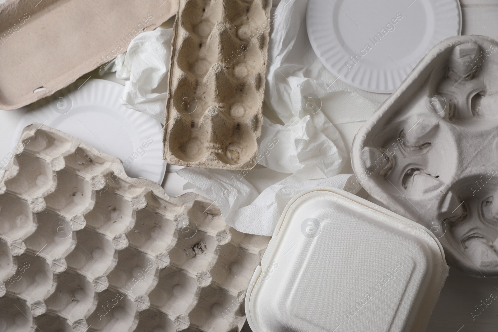 Photo of Heap of waste paper as background, top view