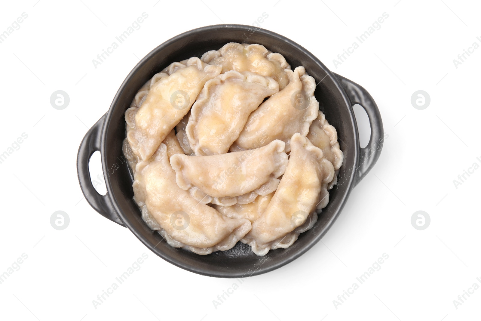 Photo of Bowl of delicious dumplings (varenyky) with cottage cheese isolated on white, top view