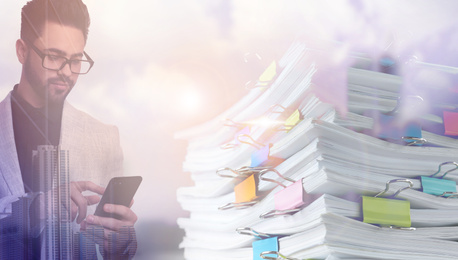 Image of Multiple exposure of businessman with smartphone, documents and cityscape