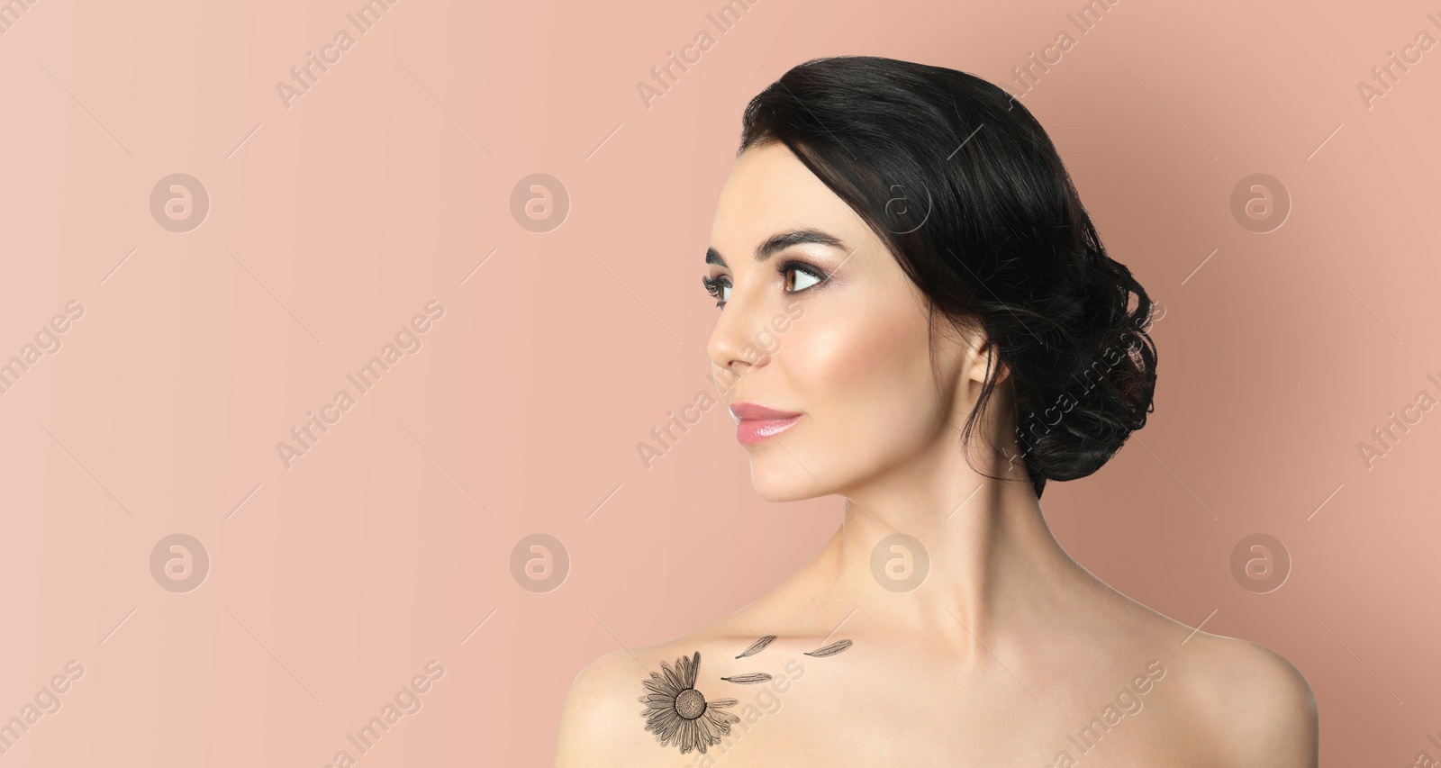 Image of Young woman with beautiful flower tattoo on pale peach background, space for text. Banner design