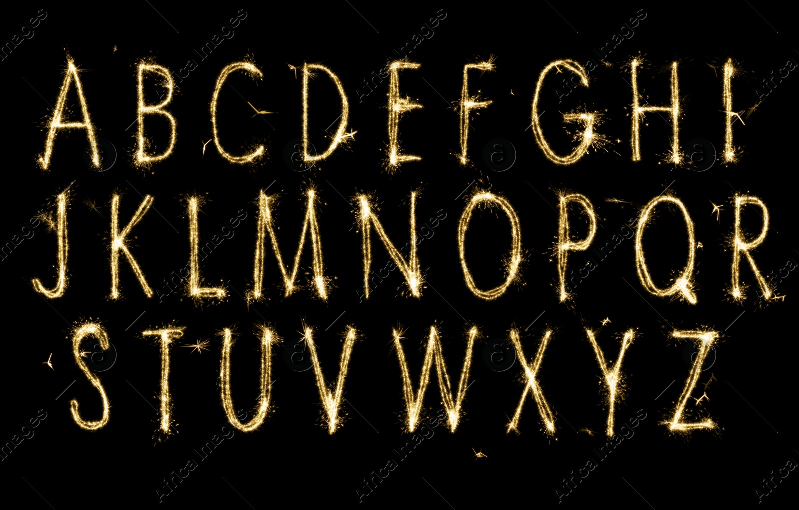 Image of Set with letters made of sparkler on black background