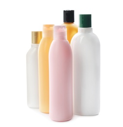 Bottles with cosmetic products on white background. Mockup for design