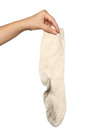 Photo of Woman holding dirty socks on white background, closeup