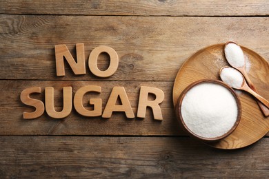 Photo of Flat lay composition with phrase No Sugar on wooden table