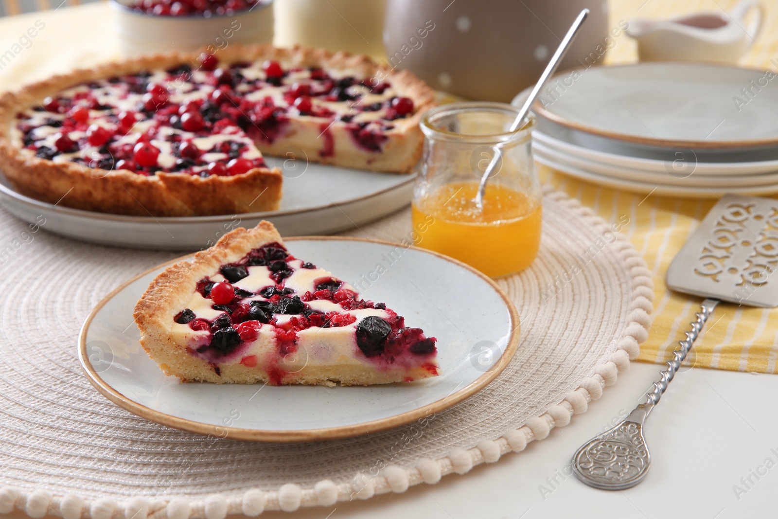 Photo of Piece of delicious currant pie on white table