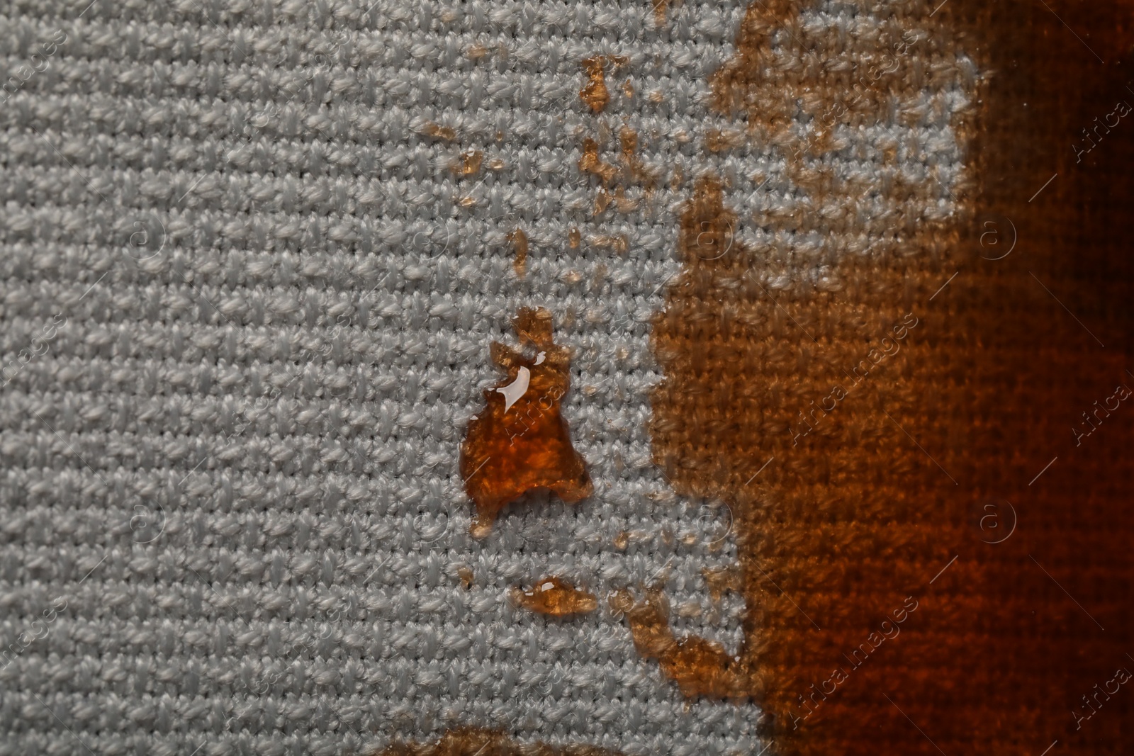 Photo of Dirty jacket with stain of coffee as background, top view. Space for text