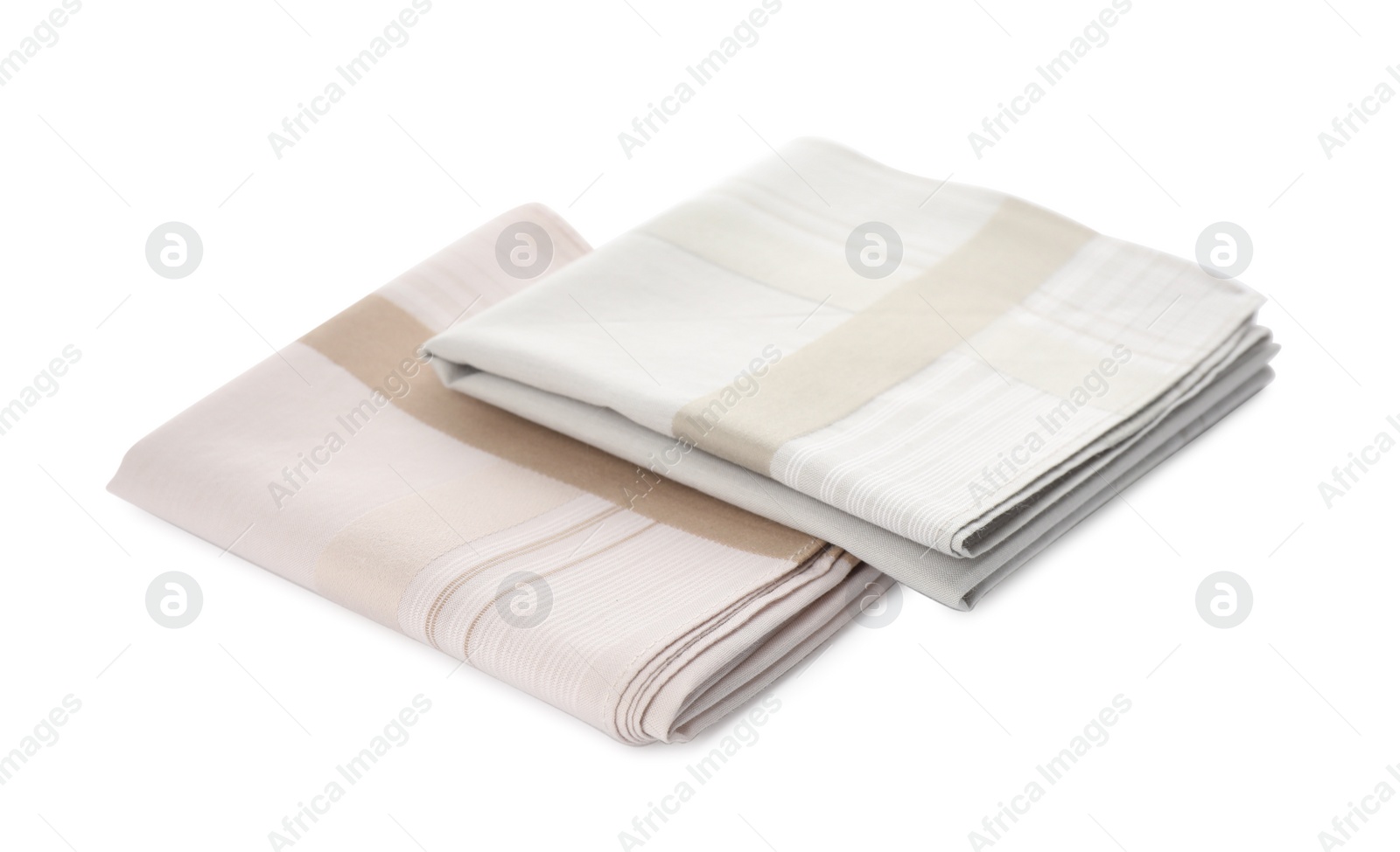 Photo of Folded handkerchiefs on white background. Stylish accessory