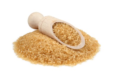 Pile of brown sugar and scoop isolated on white