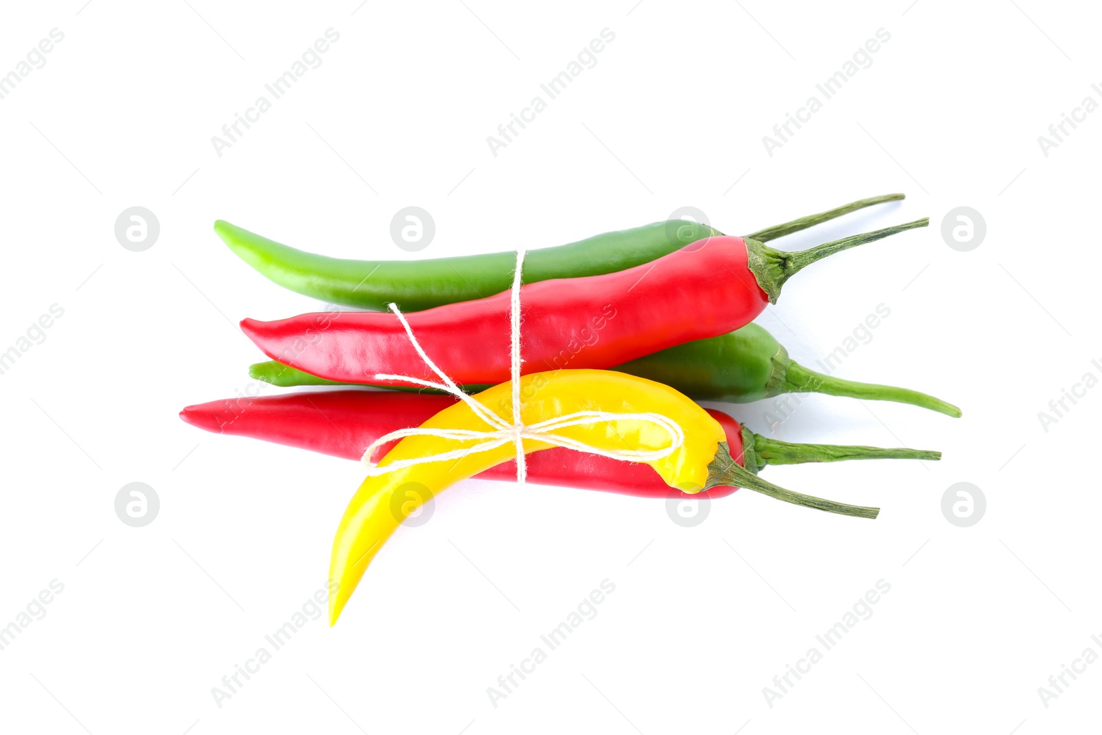 Photo of Ripe hot chili peppers on white background