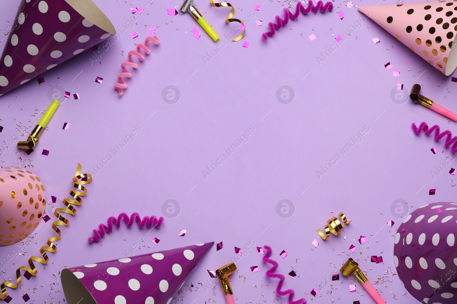 Photo of Frame of party items on pale violet background, flat lay. Space for text