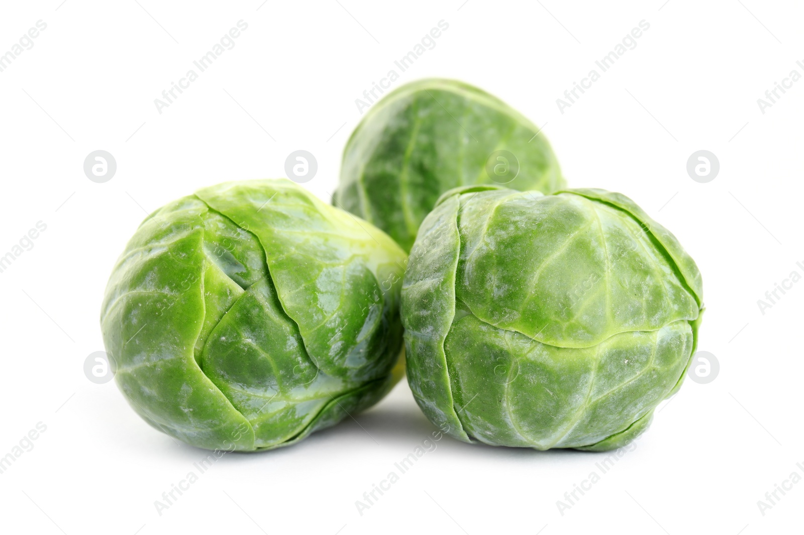 Photo of Fresh tasty Brussels sprouts isolated on white