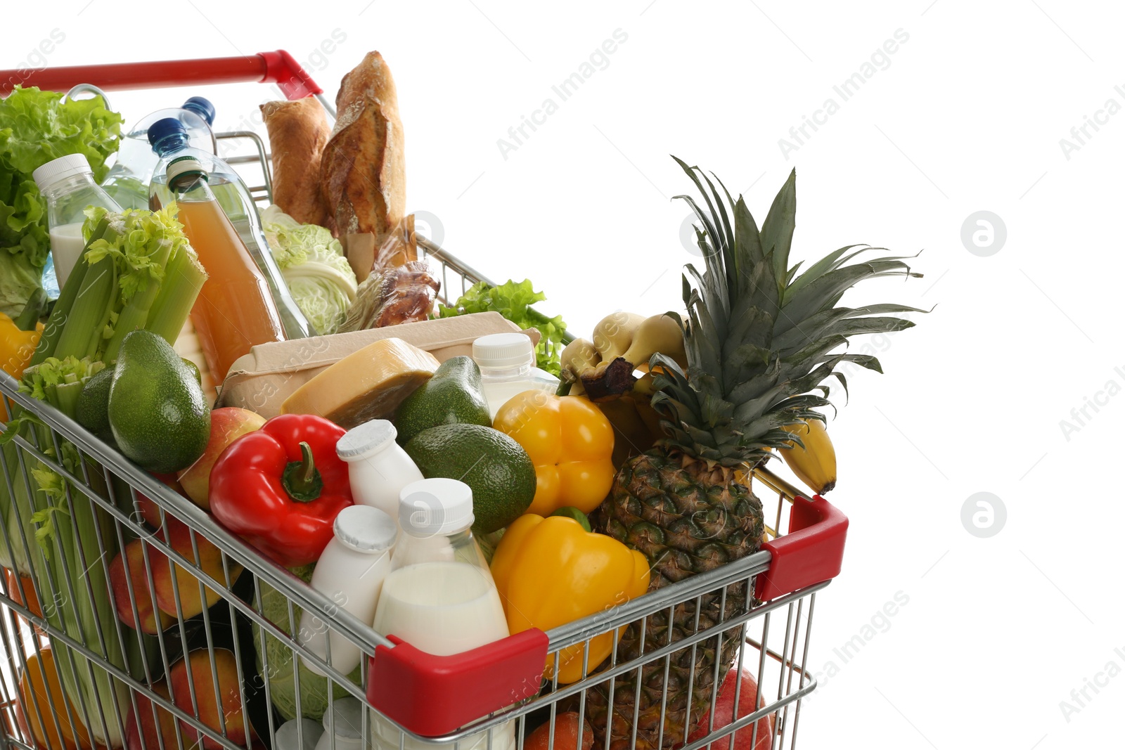 Photo of Shopping cart with groceries on white background