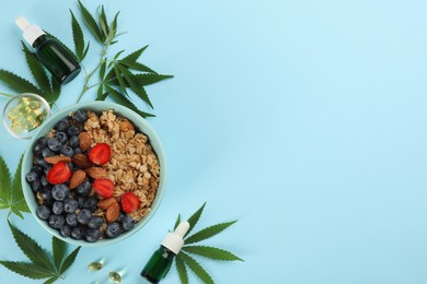 CBD oil, THC tincture, oatmeal bowl and hemp leaves on light blue background, flat lay. Space for text