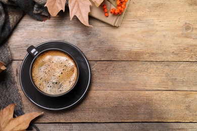 Flat lay composition with hot drink on wooden background, space for text. Cozy autumn