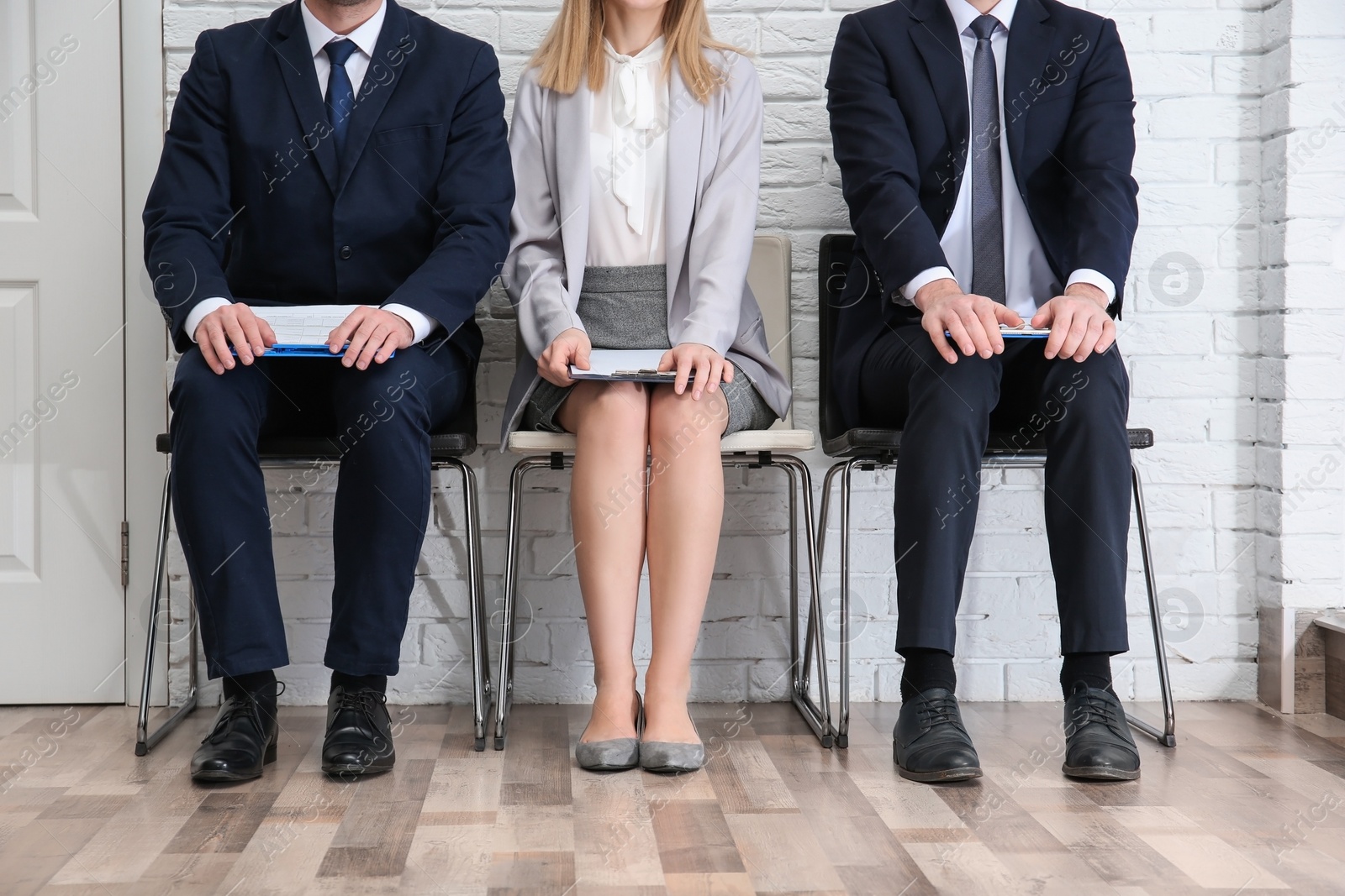 Photo of Group of people waiting for job interview, indoors