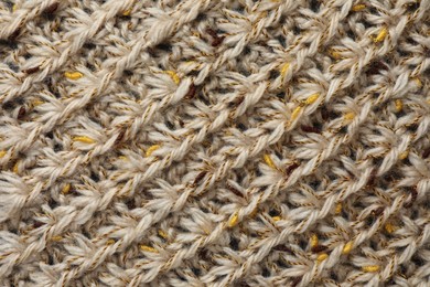 Photo of Texture of knitted fabric as background, top view