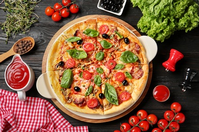 Flat lay composition with tasty homemade pizza on table