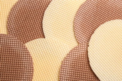 Photo of Tasty wafers as background, closeup. Crispy food