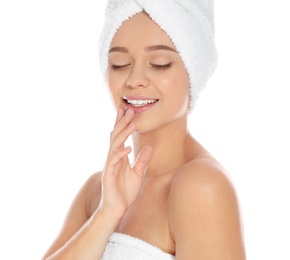 Photo of Portrait of young pretty woman with towels on white background