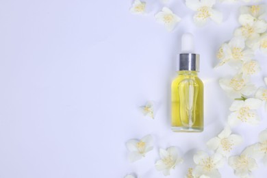 Photo of Essential oil in bottle and beautiful jasmine flowers on white background, flat lay. Space for text