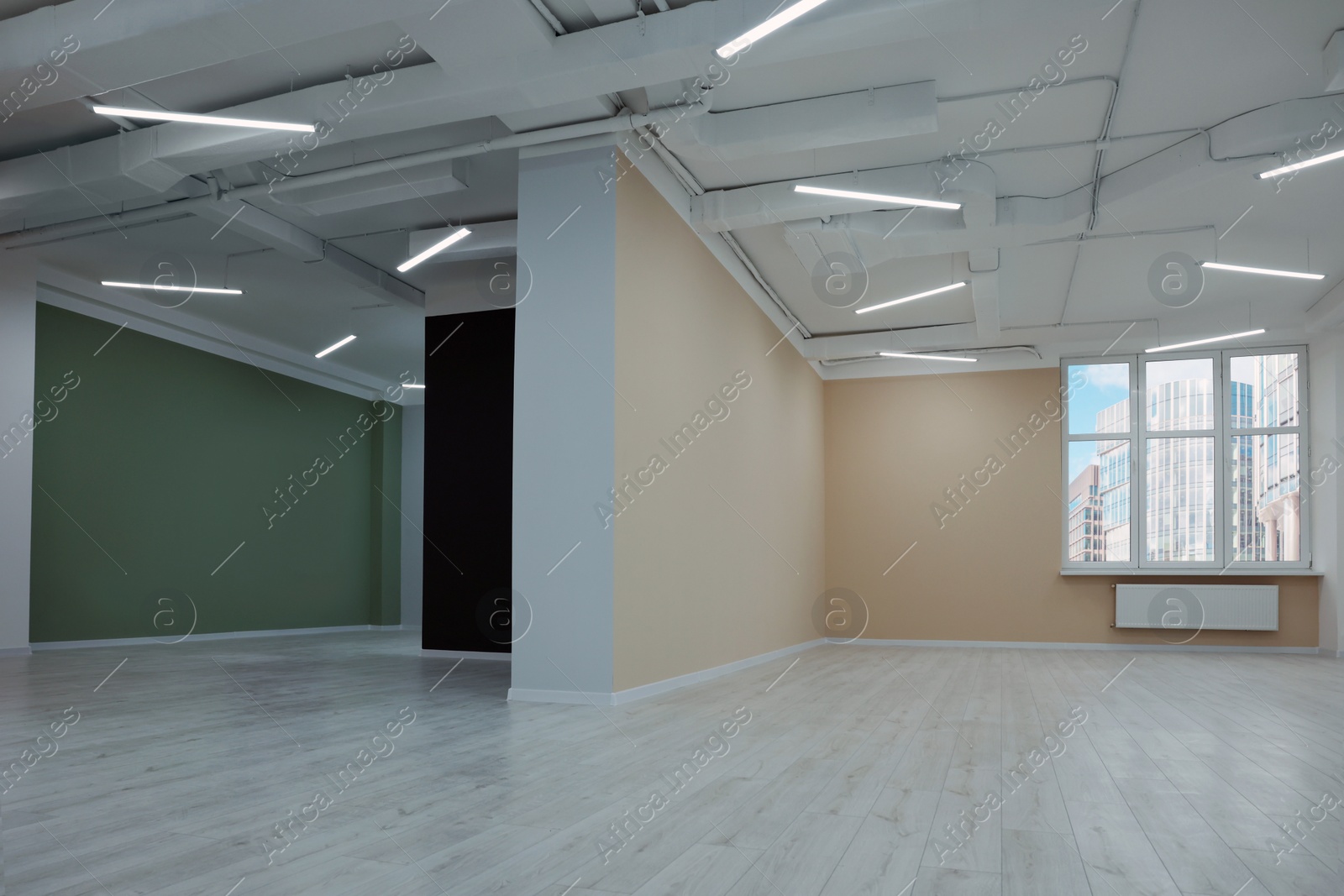 Photo of New empty room with clean windows and color walls