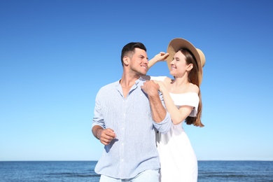 Photo of Lovely couple together on beach. Summer vacation