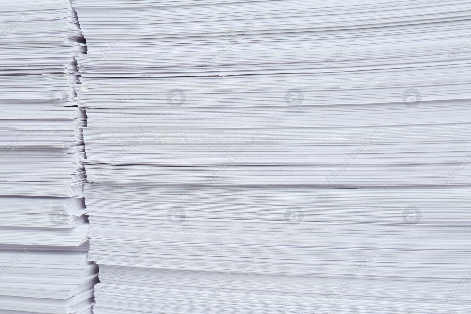 Photo of Stacks of white paper sheets, closeup view