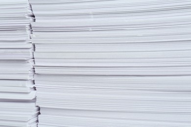 Photo of Stacks of white paper sheets, closeup view