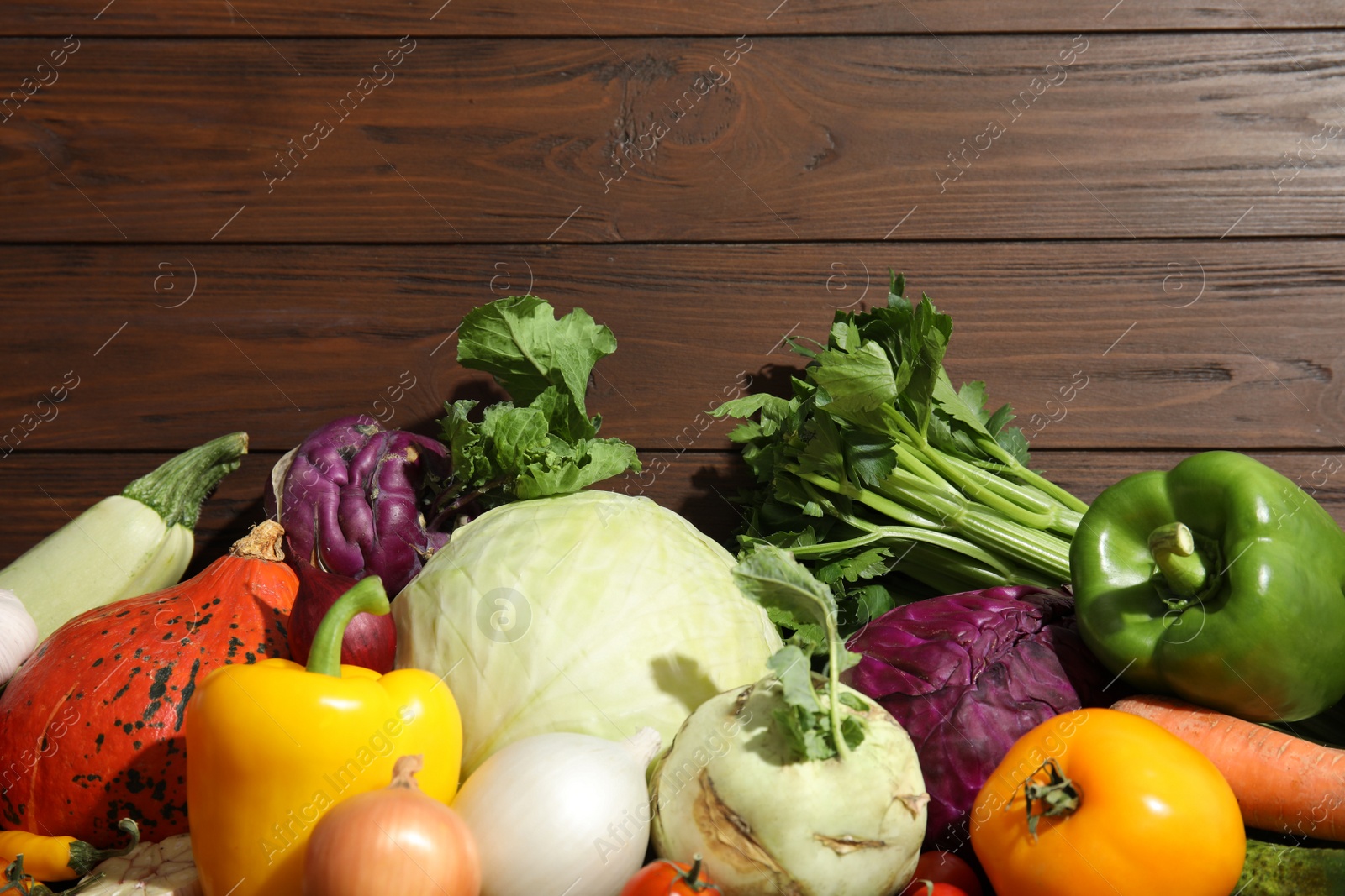 Photo of Many fresh ripe vegetables on wooden background, top view. Organic food