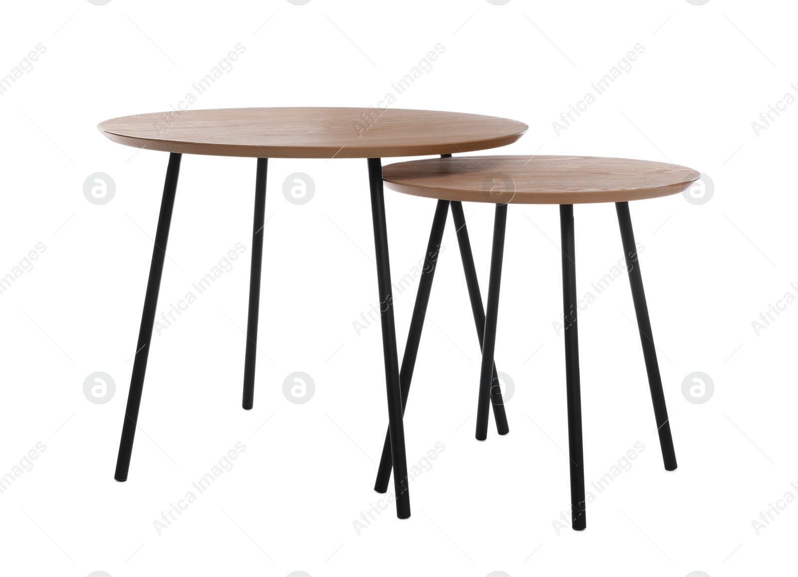 Photo of Empty wooden nesting tables isolated on white