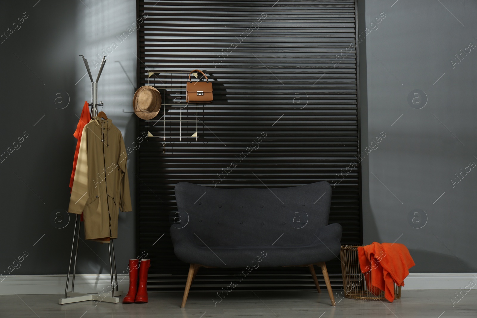 Photo of Hallway interior with sofa, clothes and accessories