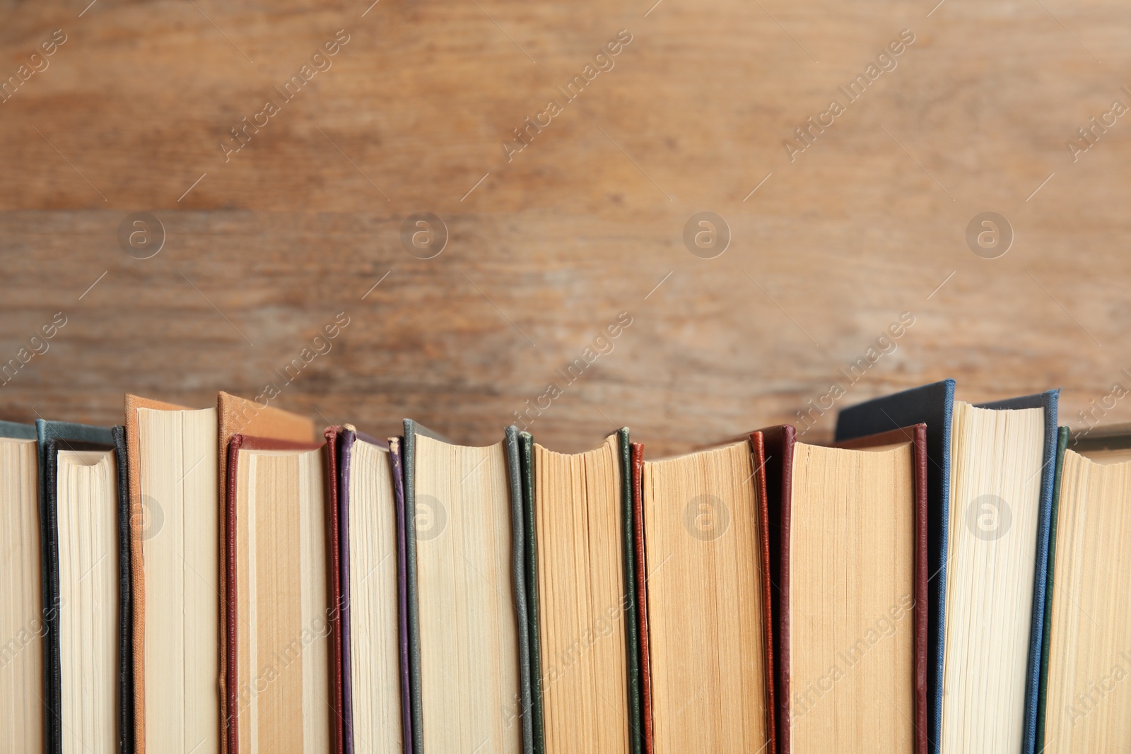 Photo of Collection of old books on wooden background