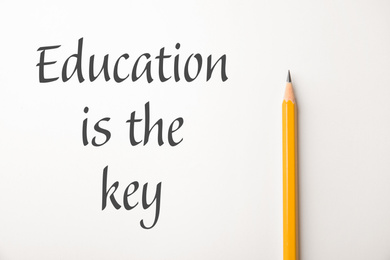 Image of Phrase Education is the key and sharp pencil on white background, top view. Adult learning