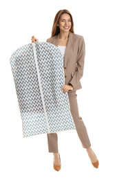 Photo of Young woman holding garment cover with clothes on white background. Dry-cleaning service