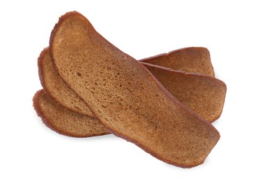 Delicious crispy rusks on white background, top view