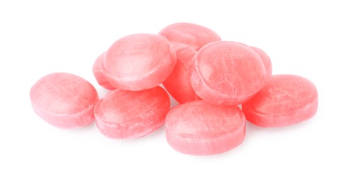 Photo of Many pink cough drops on white background