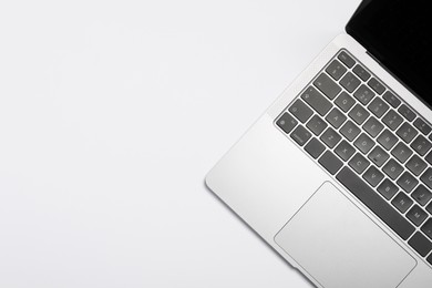 Modern laptop on white background, top view. Space for text