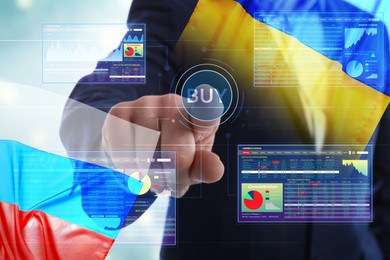 Image of Multiple exposure of Ukrainian, Russian flags, man and digital stock exchange market charts