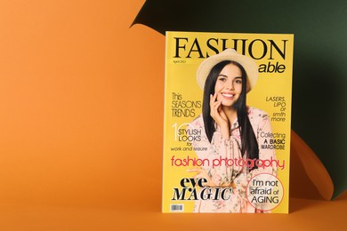Modern fashion magazine on color background. Space for text