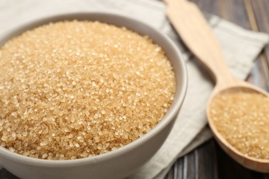 Brown sugar in bowl on table, closeup