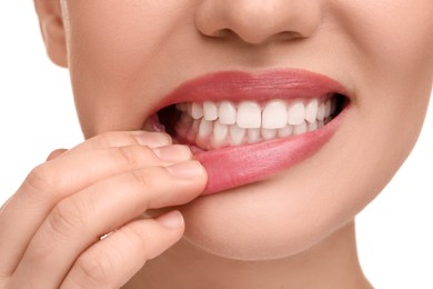 Photo of Woman showing her clean teeth on white background, closeup