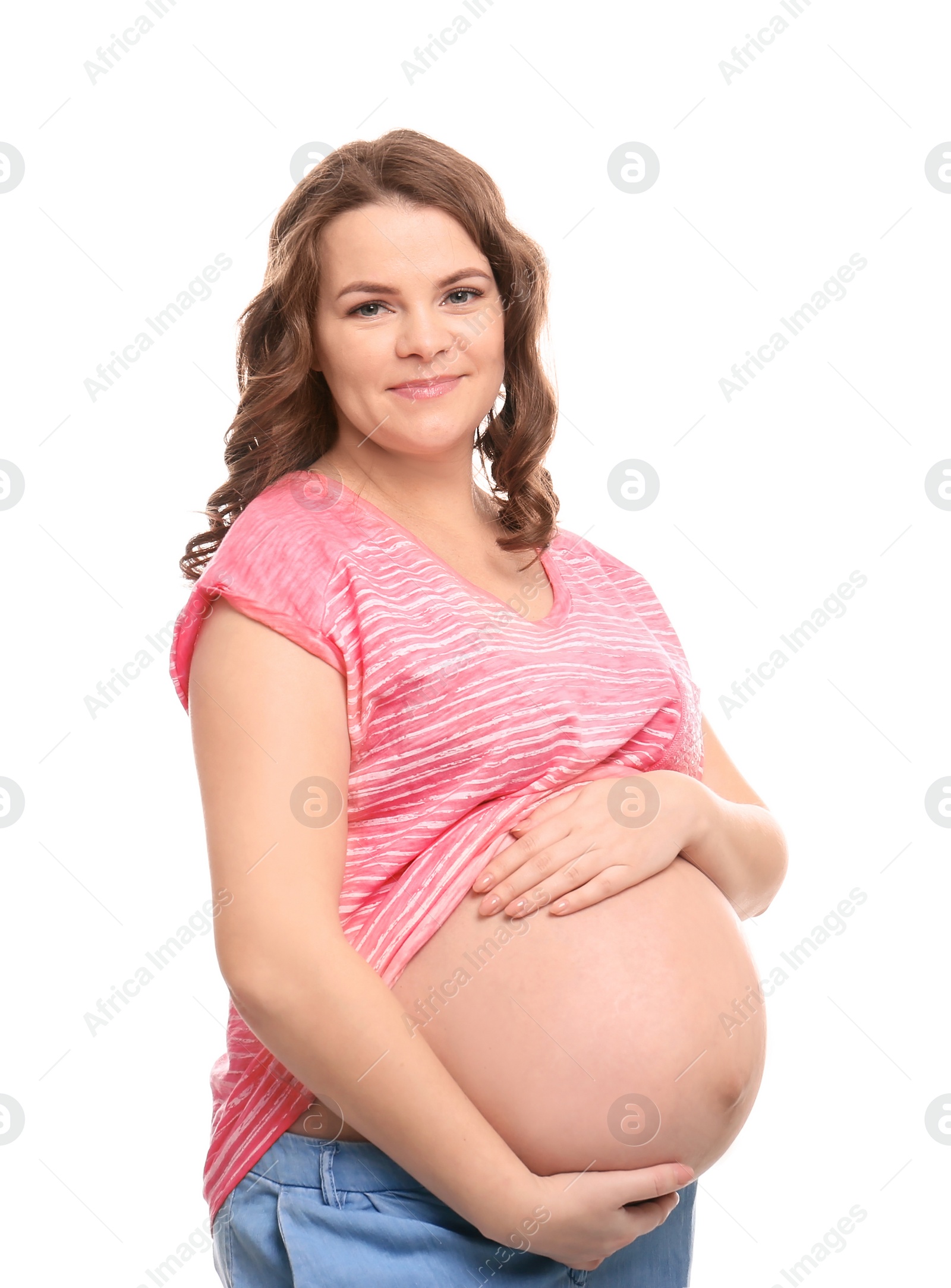 Photo of Young pregnant woman in casual clothes on white background