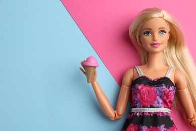 Photo of Mykolaiv, Ukraine - September 4, 2023: Beautiful Barbie doll with ice cream on color background, space for text